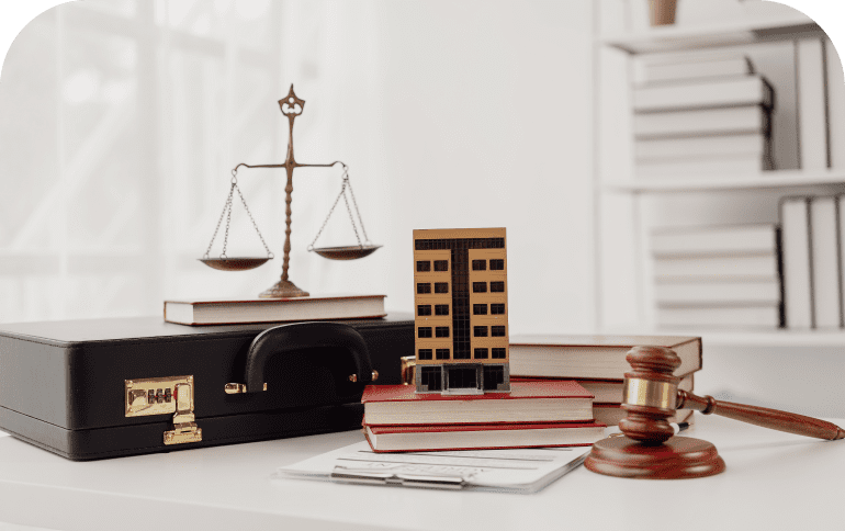 Scales, gavel, books on lawyer's desk.